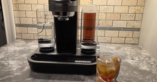Bartesian cocktail maker beside a finished Old Fashioned on a kitchen counter